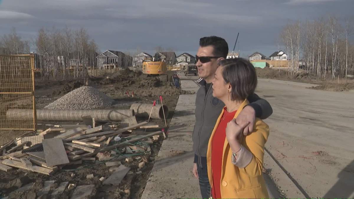 Calgary couple looking over the site of their new home
