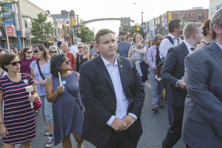 Councillor Michael Ford walks in a candlelight procession along Danforth Ave. in Greek Town in Toronto on July 25, 2018. 