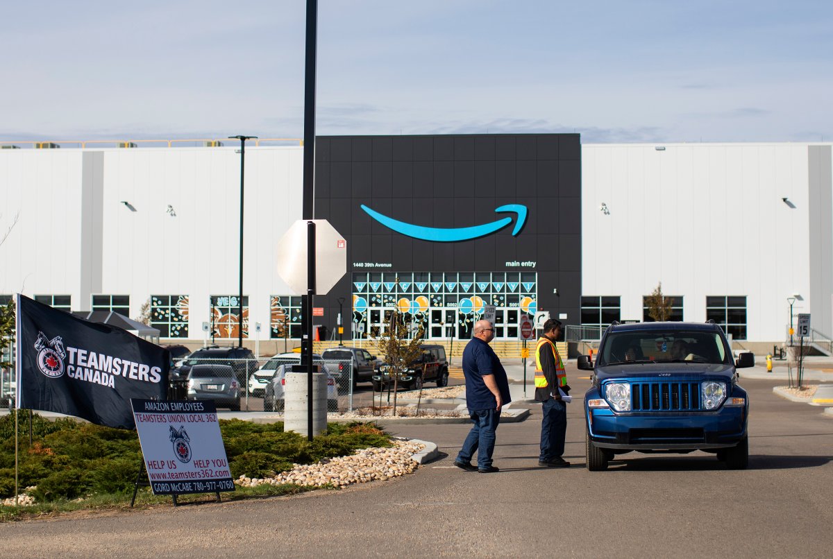Organizers from Teamsters Local Union 362 rally outside an Amazon facility to get support and distribute information to Amazon workers, in Nisku, Alta, on Tuesday, September 14, 2021.