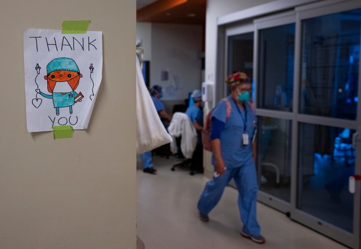 A health-care worker walks past a thank you sign in the intensive care unit at the Humber River Hospital during the COVID-19 pandemic in Toronto on Tuesday, January 25, 2022. 