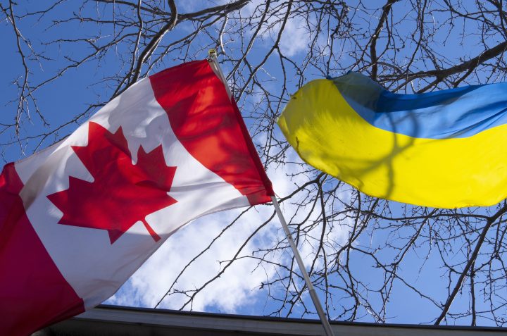 A photo of a Canadian flag and a Ukrainian flag