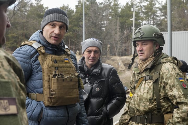 Vitali Klitschko, Kyiv Mayor and former heavyweight champion, left, visits a checkpoint in Kyiv, Ukraine, Sunday, March 6, 2022. 