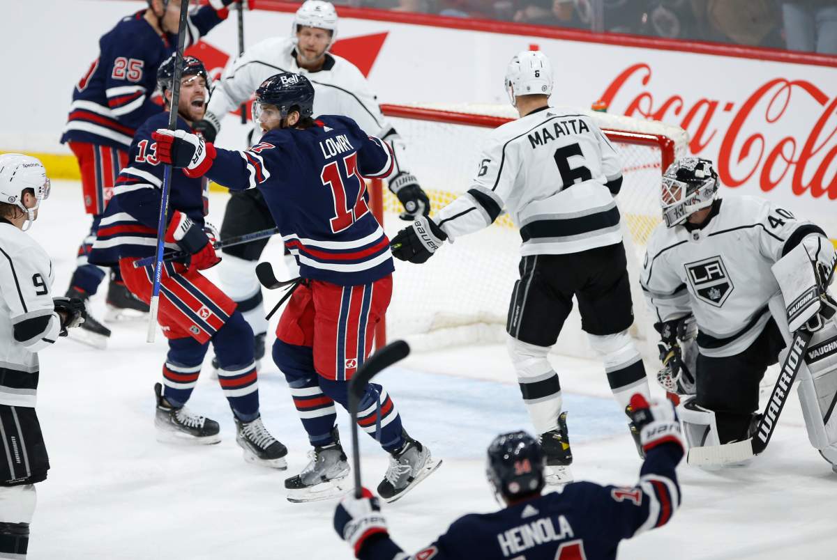 Winnipeg Jets Adam Lowry (17) and Zach Sanford (13) celebrate Lowry’s goal against Los Angeles Kings goaltender Cal Petersen (40) during second period NHL action in Winnipeg, Saturday, April 2, 2022.