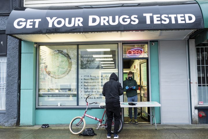 Allen Custance, site manager of Get Your Drugs Tested, helps take samples from a patron in Vancouver, B.C. on Friday April 1, 2022. An animal tranquilizer, called Xylazine, is making its way into the drug supply and has been linked to a growing number of deaths in Ontario. 