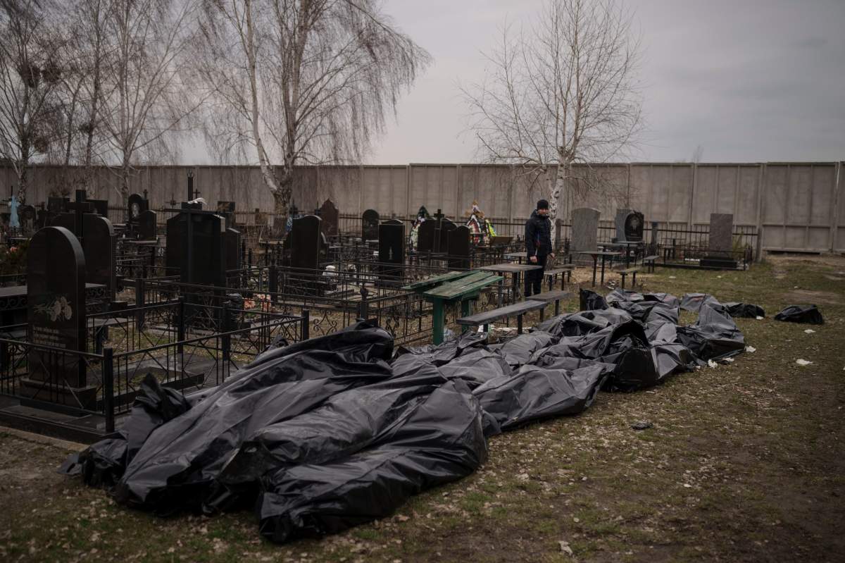 Dozens of bodies wait to be buried at a cemetery in Bucha, outskirts of Kyiv, Ukraine, Tuesday, April 5, 2022. Ukraineâ€™s president told the U.N. Security Council on Tuesday that the Russian military must be brought to justice immediately for war crimes, accusing invading troops of the worst atrocities since World War II. He stressed that Bucha was only one place and there are more with similar horrors. (AP Photo/Felipe Dana)