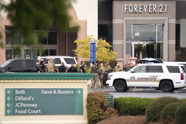 Members of law enforcement gather outside Columbiana Centre mall in Columbia, S.C., following a shooting, Saturday, April 16, 2022.
