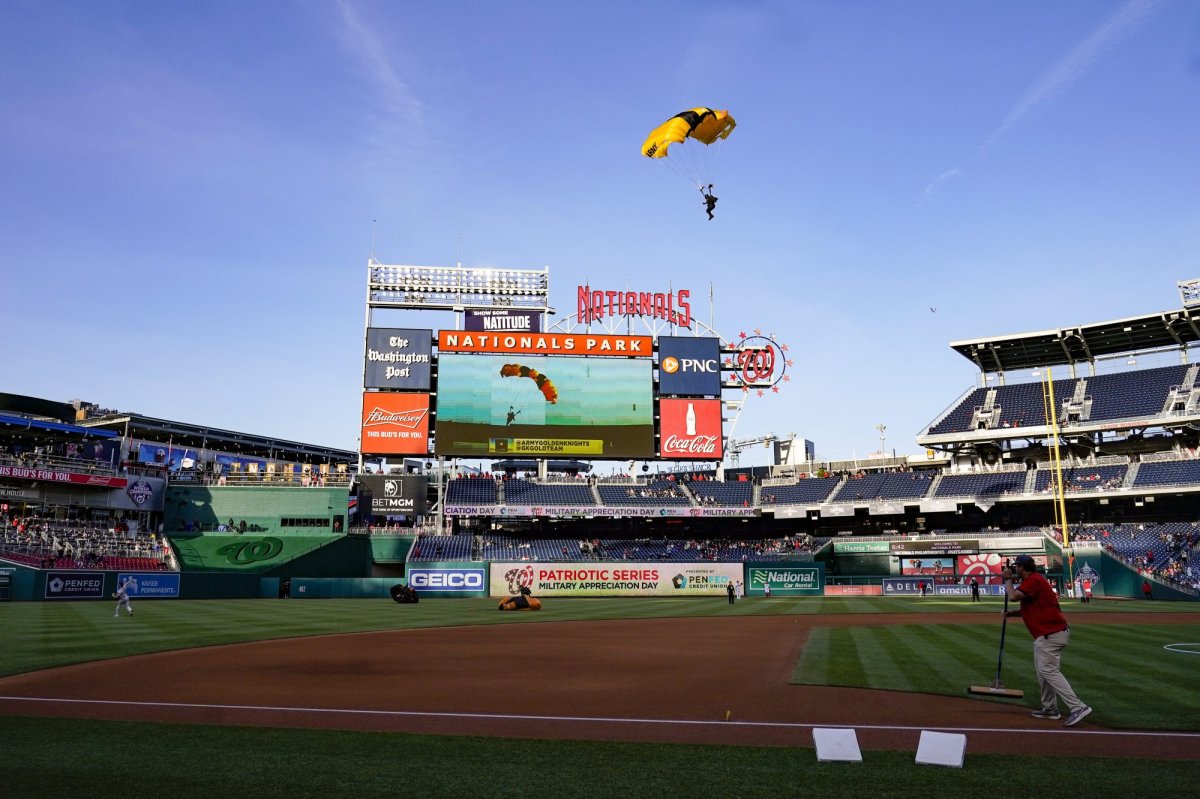 The U.S. Army Parachute Team the Golden Knights descend into National Park before a baseball game between the Washington Nationals and the Arizona Diamondbacks Wednesday, April 20, 2022, in Washington. The U.S. Capitol was briefly evacuated after police said they were tracking an aircraft â€œthat poses a probable threat,â€ but the plane turned out to be the military aircraft with people parachuting out of it for a demonstration at the Nationals game, officials told The Associated Press. (AP Photo/Alex Brandon).
