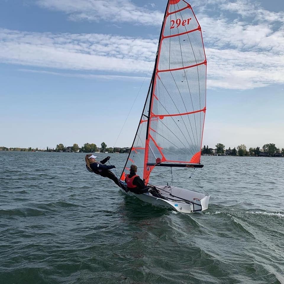 Charlise Bruchet (left) in a photo sailing, before catching COVID-19 in spring 2021.