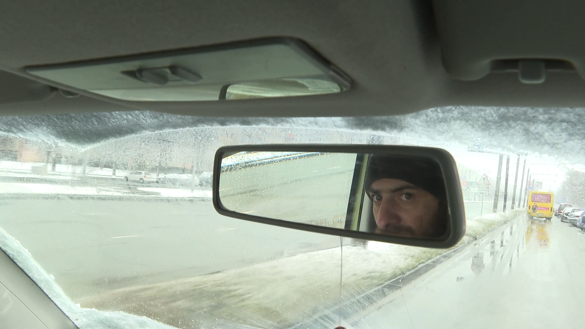 Lex Brukovskiy driving his van in Lviv, Ukraine.