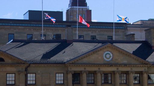 Flags fly at half-mast outside Province House in Halifax on April 18, 2022, to mark two years since the Nova Scotia mass shooting.