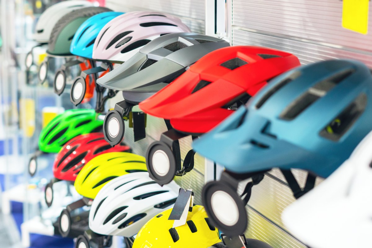 A row of bicycle helmets.