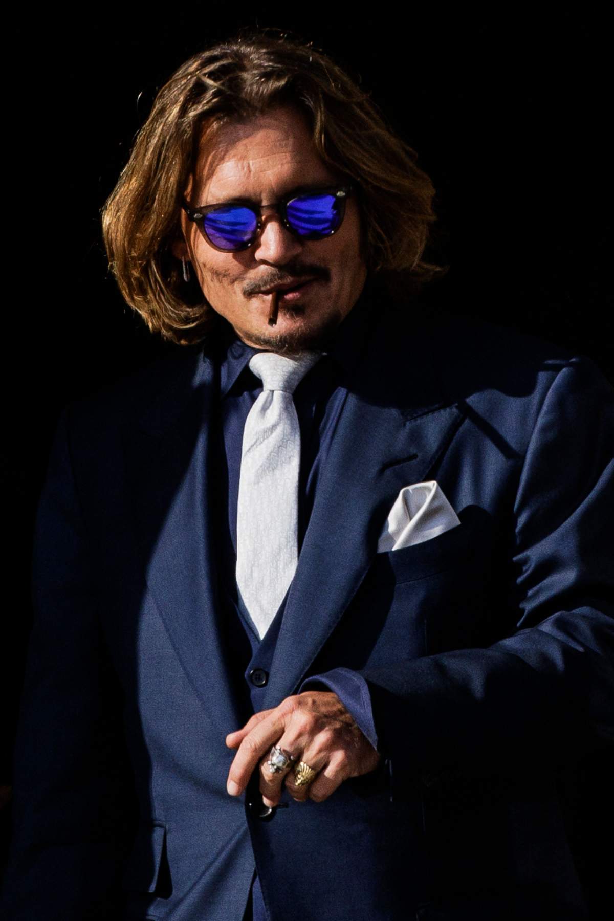 US actor Johnny Depp leaves the Fairfax County Circuit Court after the first day in the lawsuit between him and his former wife, US actress Amber Heard, in Fairfax, Virginia, on April 12, 2022. - Depp filed a defamation lawsuit against his former wife after she wrote an op-ed in The Washington Post in 2018 that, without naming Depp, accused him of domestic abuse.