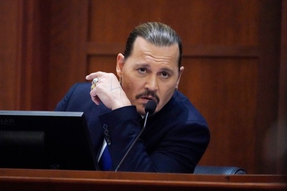 Actor Johnny Depp testifies in the courtroom at the Fairfax County Circuit Courthouse in Fairfax, Virginia, April 25, 2022.