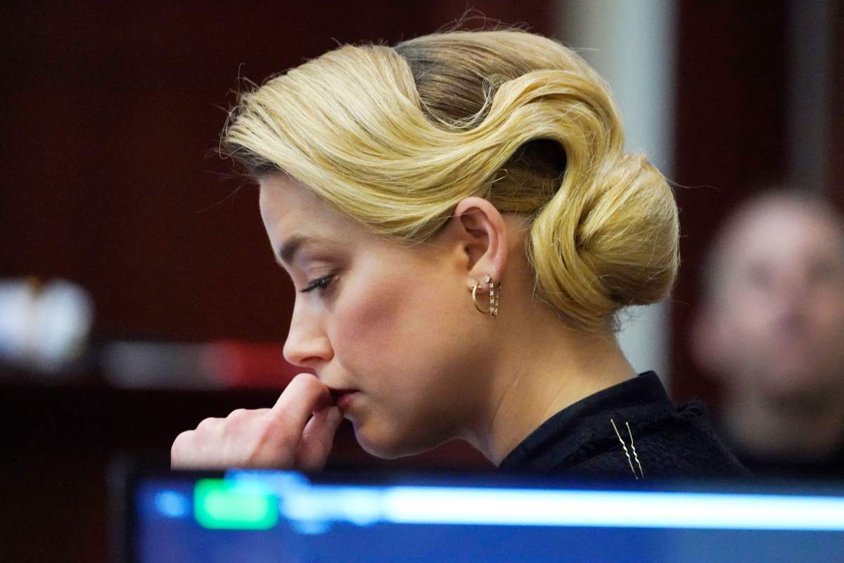 Actress Amber Heard listens in the courtroom at the Fairfax County Circuit Courthouse in Fairfax, Virginia, April 25, 2022.