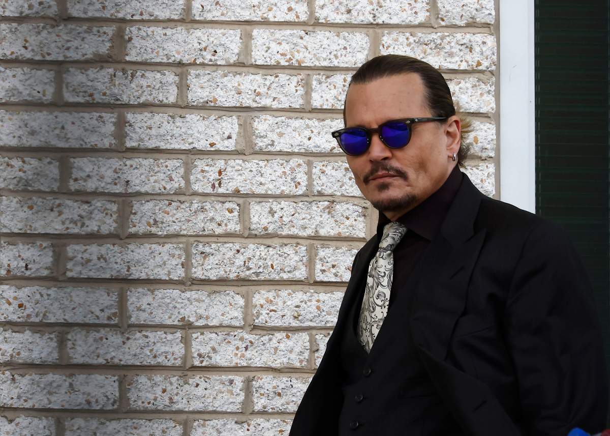 Johnny Depp steps outside court during the 8th day of his civil trial at Fairfax County Circuit Court on April 19, 2022 in Fairfax, Virginia. Depp is seeking $50 million in alleged damages to his career over an op-ed Heard wrote in the Washington Post in 2018.