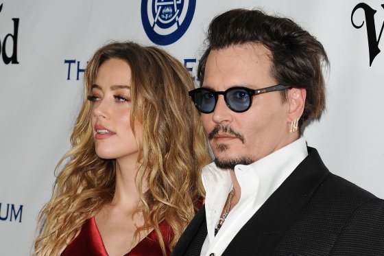 Actress Amber Heard and actor Johnny Depp attend Art of Elysium's 9th annual Heaven Gala at 3LABS on January 9, 2016 in Culver City, California.