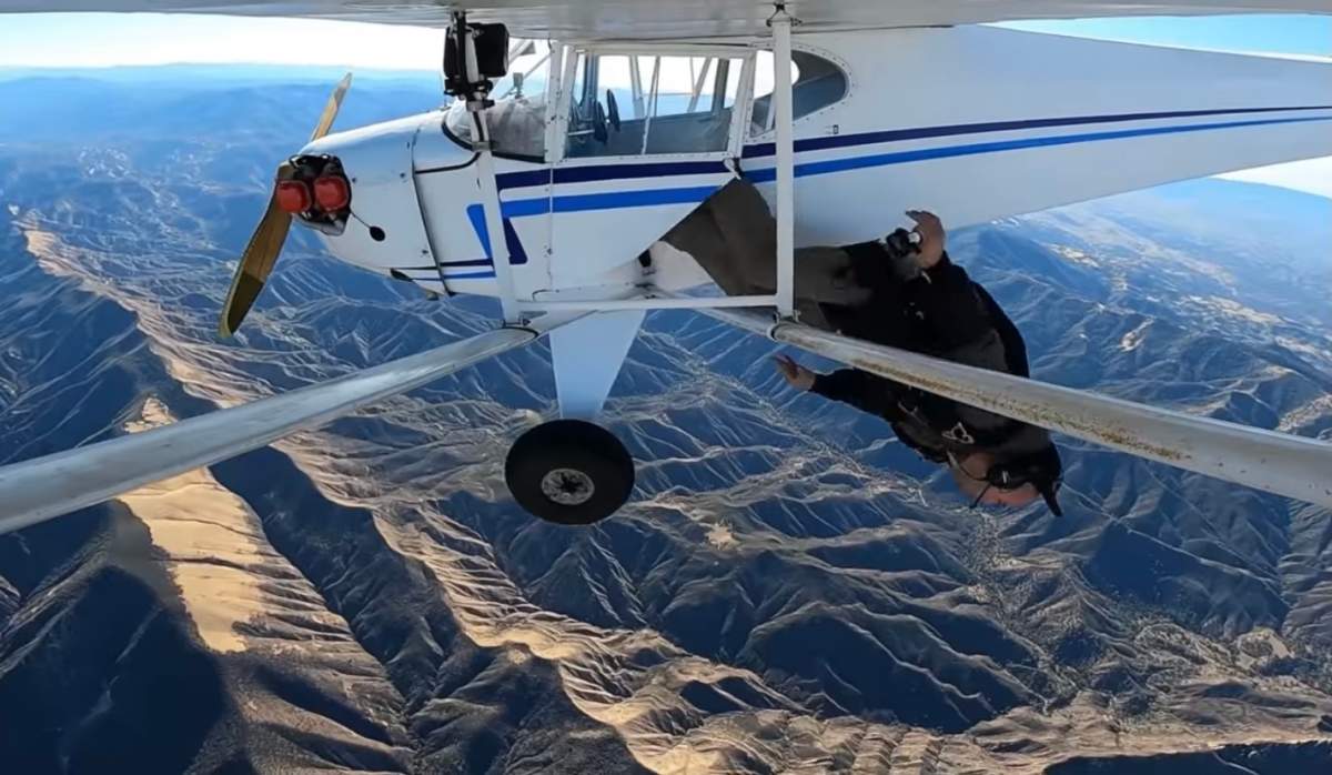 Trevor Jacob abandons and crashes his plane by diving out the side door with a parachute