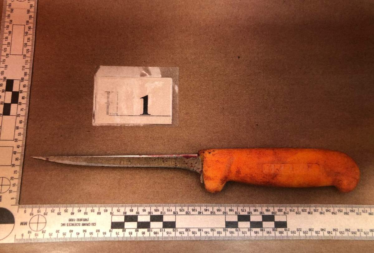 A photo shown at trial shows a blood-covered knife allegedly used in an attack on a woman inside a Vancouver courtroom on May 25, 2021.