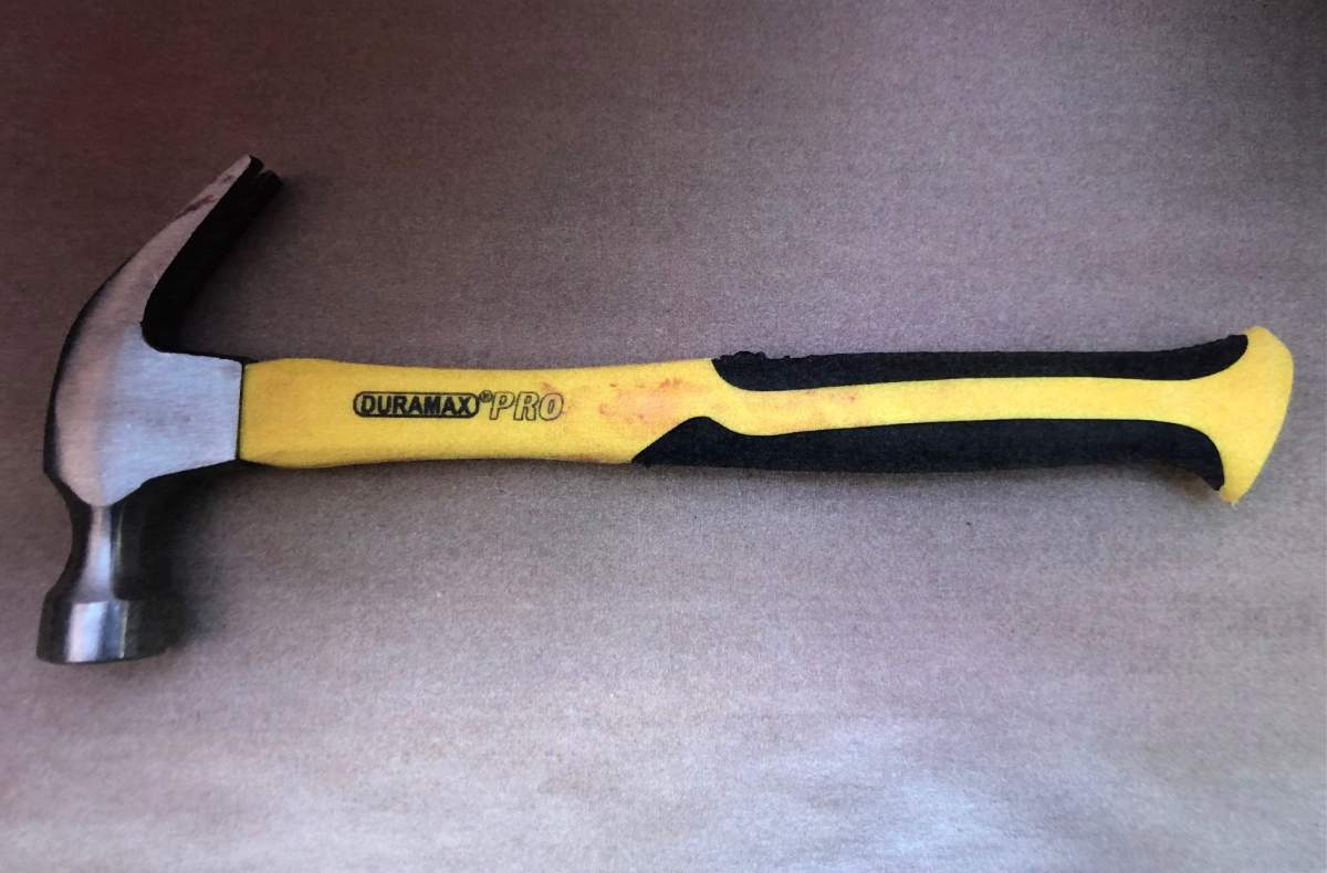 A photo shown at trial shows a blood-covered hammer allegedly used in an attack on a woman inside a Vancouver courtroom on May 25, 2021.