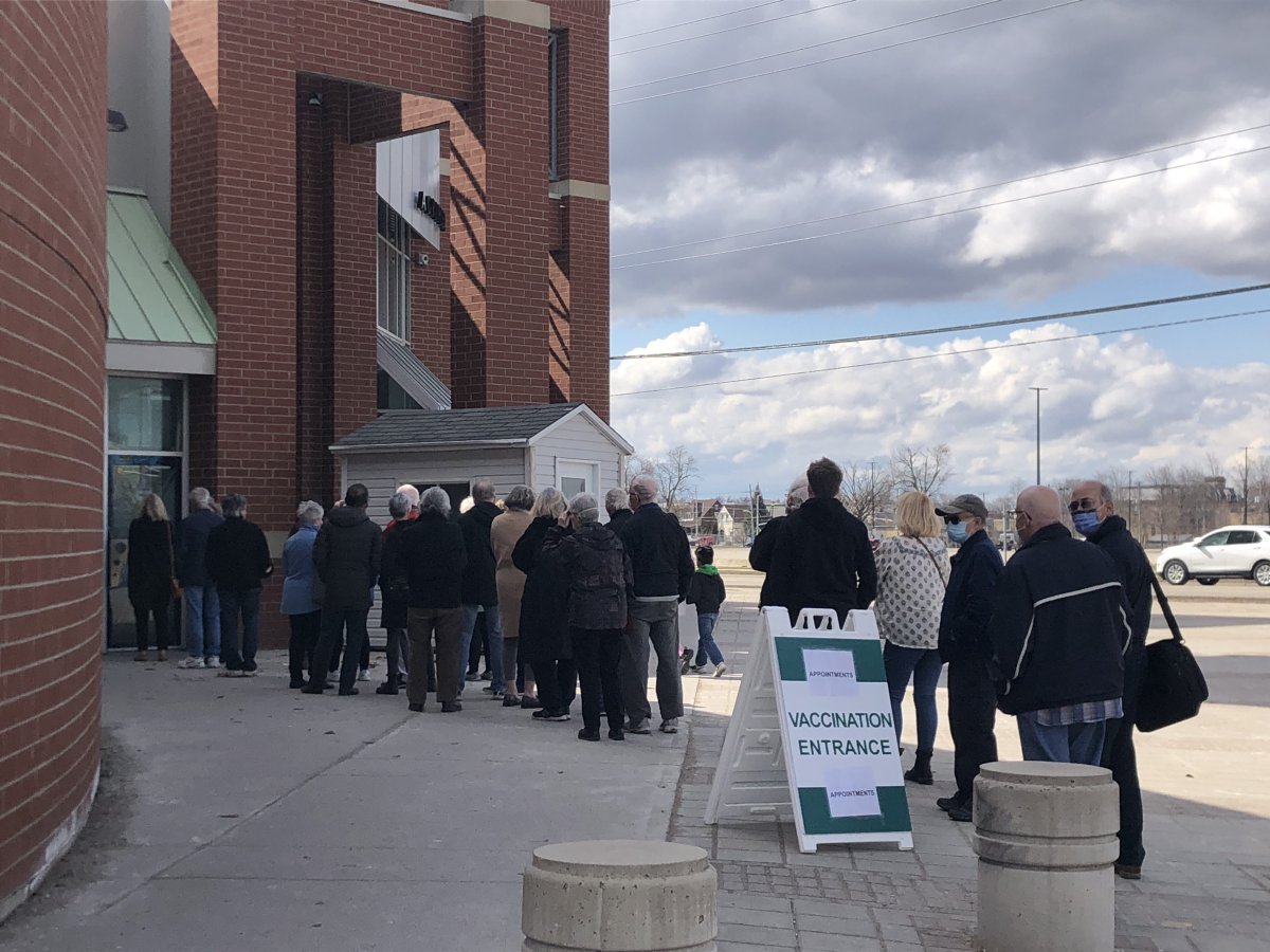 People lined up at the Western Fair District Agriplex to get the four dose of a COVID-19 vaccine. April 7, 2022.