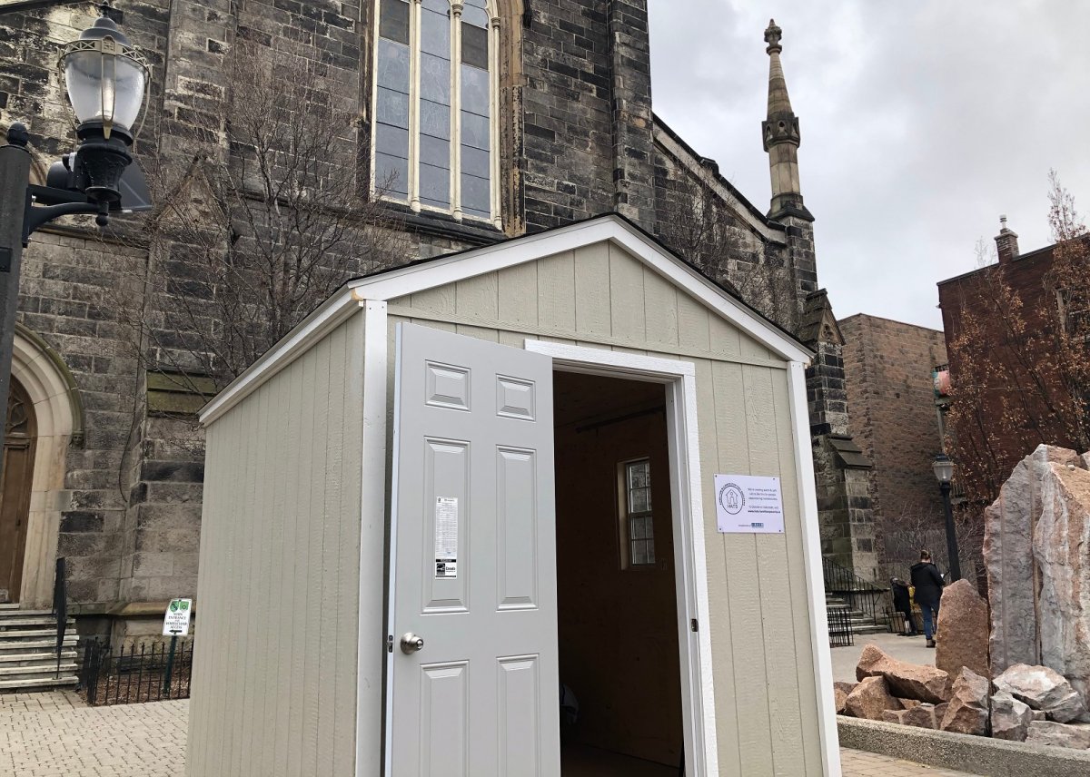 A tiny cabin for Hamilton's homeless residents in front of Christ's Church Cathedral.