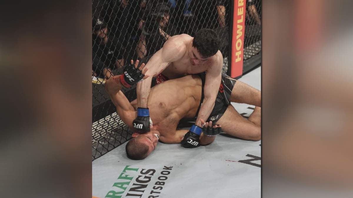 Mike Malott lands a strike on Mickey Gall in a 170-pound fight at UFC 273.