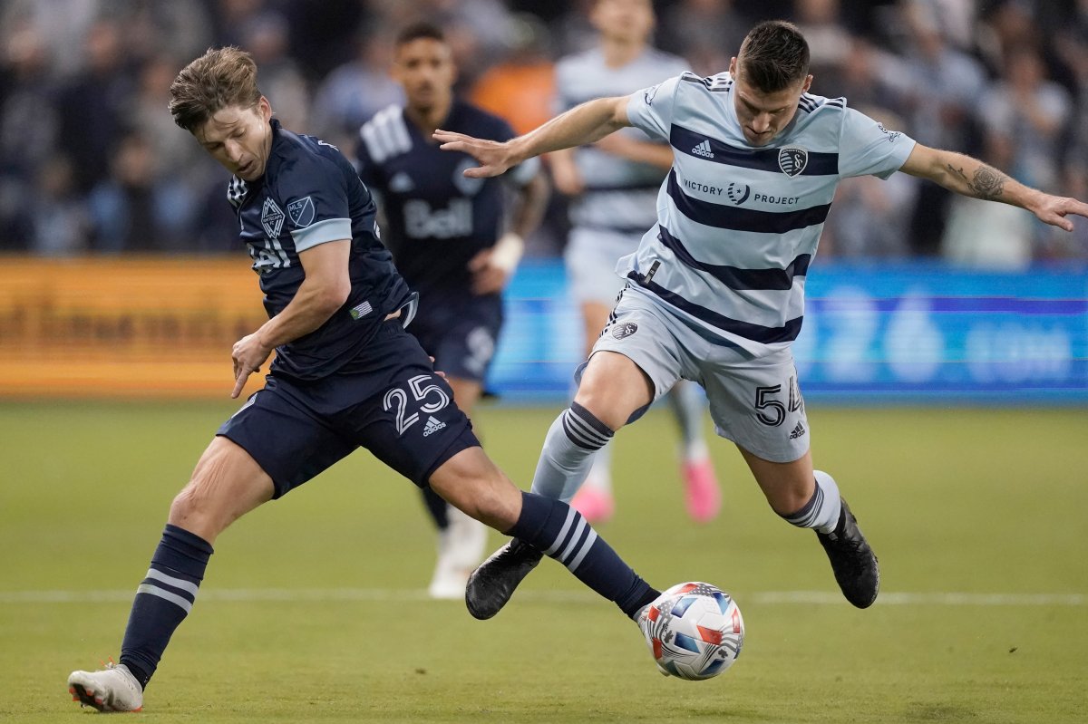Vancouver Whitecaps midfielder Ryan Gauld, left, and Sporting Kansas City midfielder Remi Walter chase the ball during MLS action last November. On Saturday, Kansas City visits Vancouver.