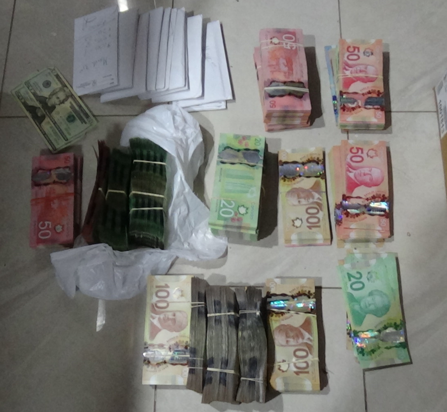 Approximately $400,000 in cash seized in the bust.