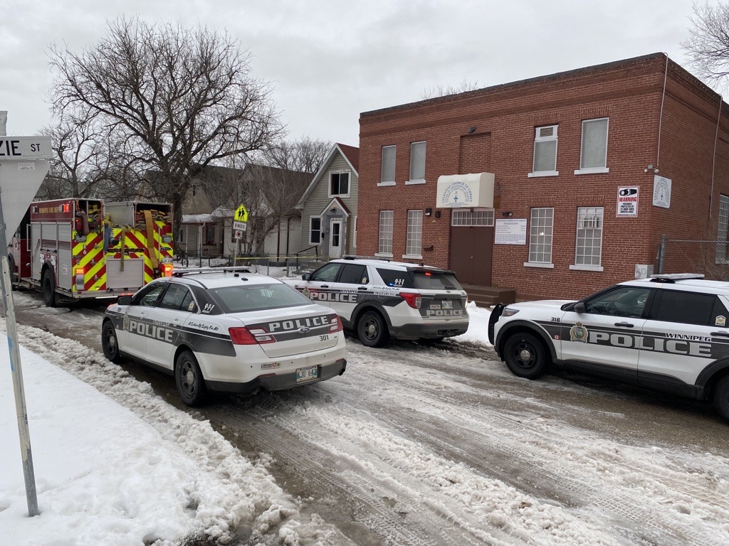 Winnipeg police at a Flora Avenue crime scene Wednesday morning.