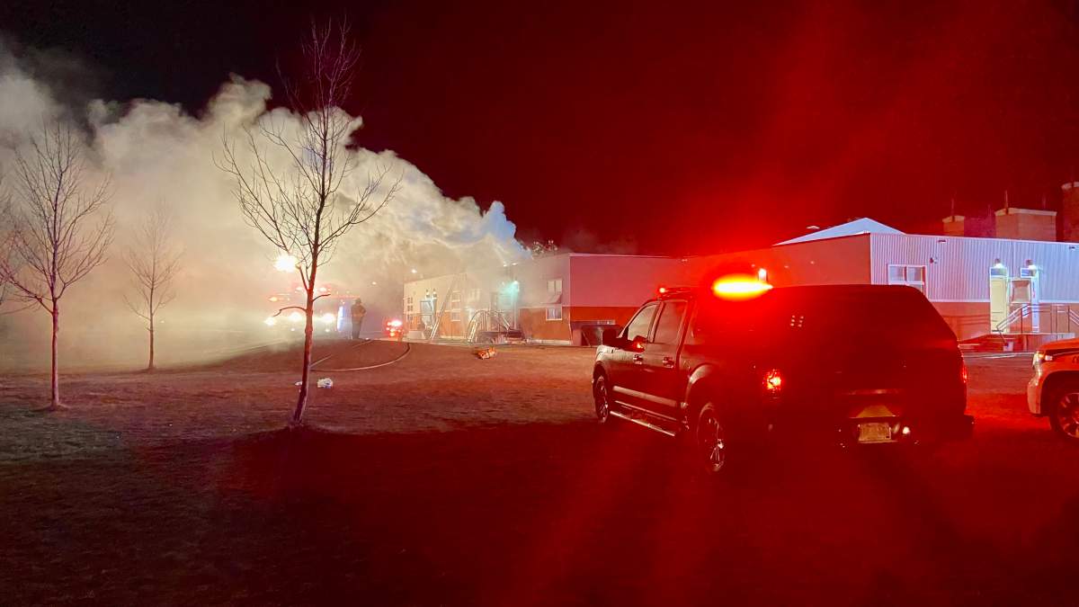 Edmonton firefighters battle a blaze at T.D. Baker School Thursday, April 14, 2022.