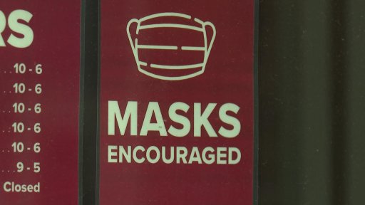 A sign outside Cyclesmith in Halifax encourages people to wear masks.