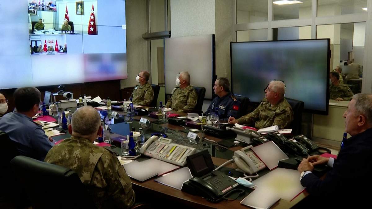 Turkish defence minister Hulusi Akar and military personnel at a command centre.