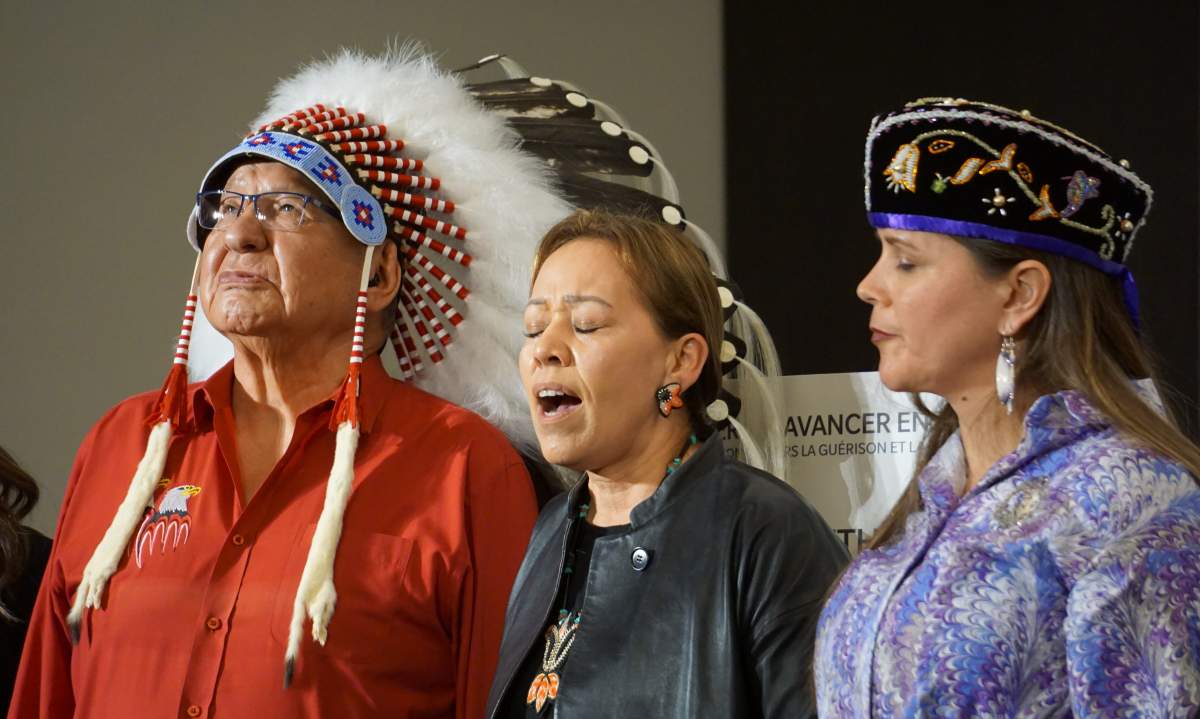 Katsitsionni Fox, a spiritual advisor for the Indigenous delegation to Rome, sings 'Sky World,' in honour of residential school victims and survivors, at the delegation's final press conference on April 1, 2022.
