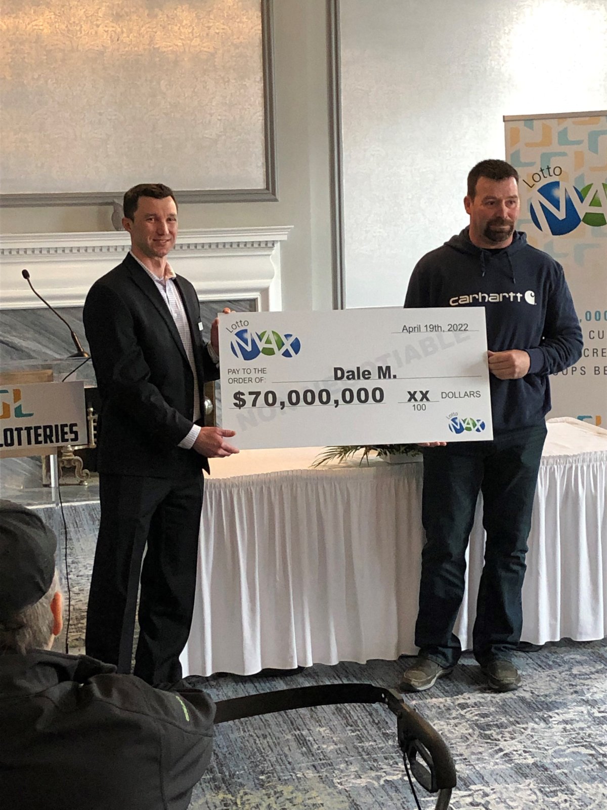 Dale McEwen of Regina, SK accepts $70 million LOTTO MAX jackpot cheque on April 19, 2022. The largest lottery win ever in western Canada.