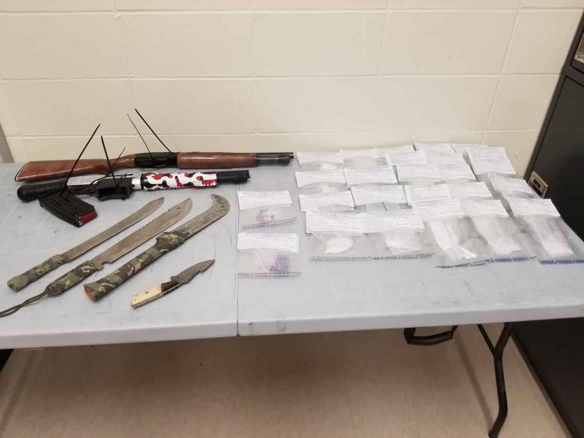 A cache of weapons and drugs seized by Hinton RCMP, in an undated photo.