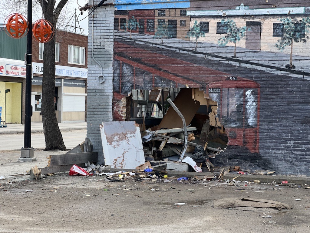 Winnipeg police say a 27-year-old man died after allegedly fleeing a traffic stop and crashing into a building.