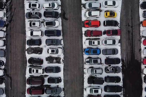 Aerial photo of cars in a dealership lot