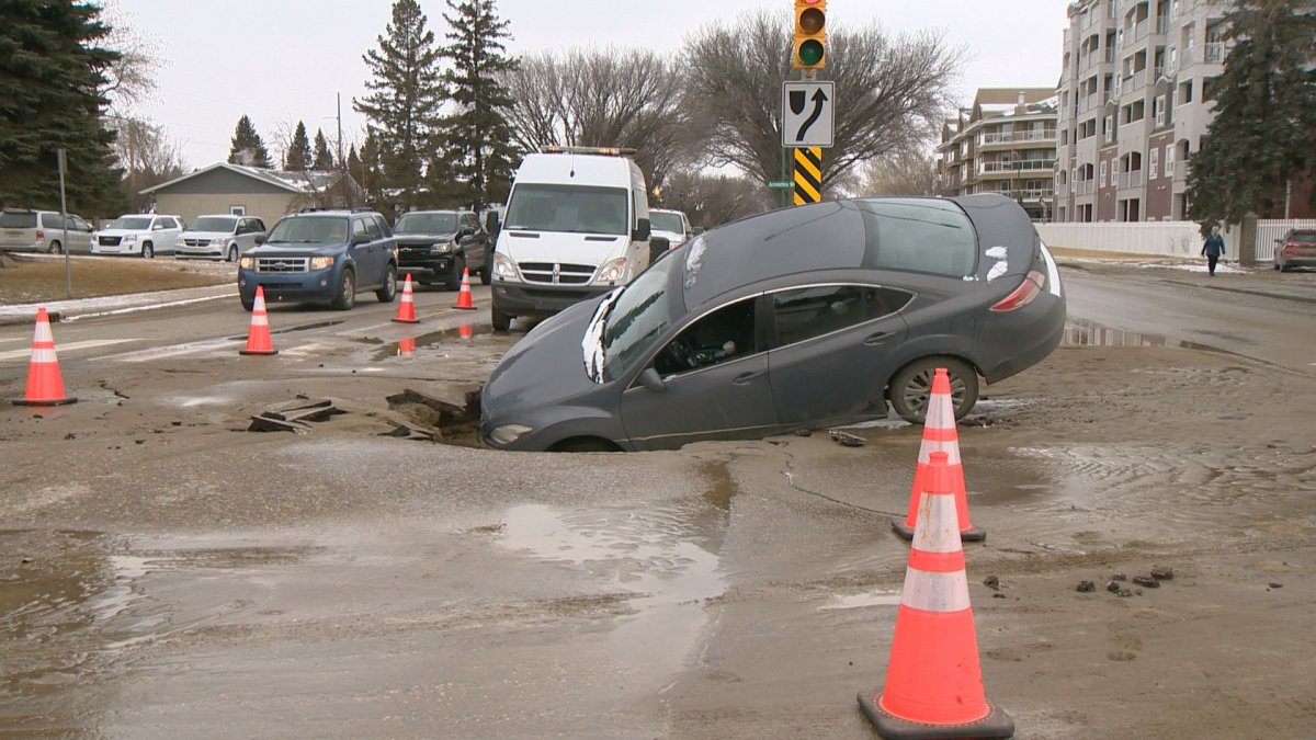 The City of Saskatoon are warning motorists to drive with caution after a vehicle gets stuck in a sinkhole on the intersection of Preston Avenue and Adelaide Street.