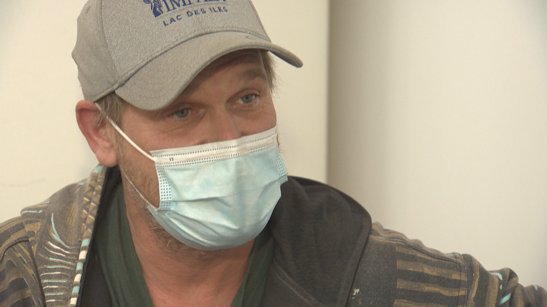 Mike Jonkers talking to Global News while waiting for his flight at YWG.
