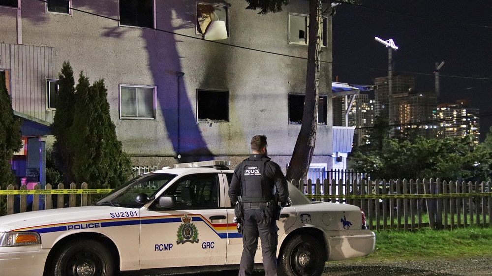 Crews on the scene of an apartment fire in Surrey, B.C., on April 5, 2022.
