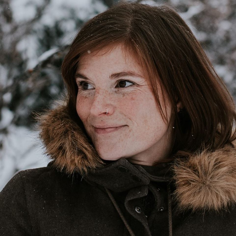 Brianna Sharpe, a freelance writer from Alberta, wearing a wool Roots coat she thrifted off of Facebook Marketplace.