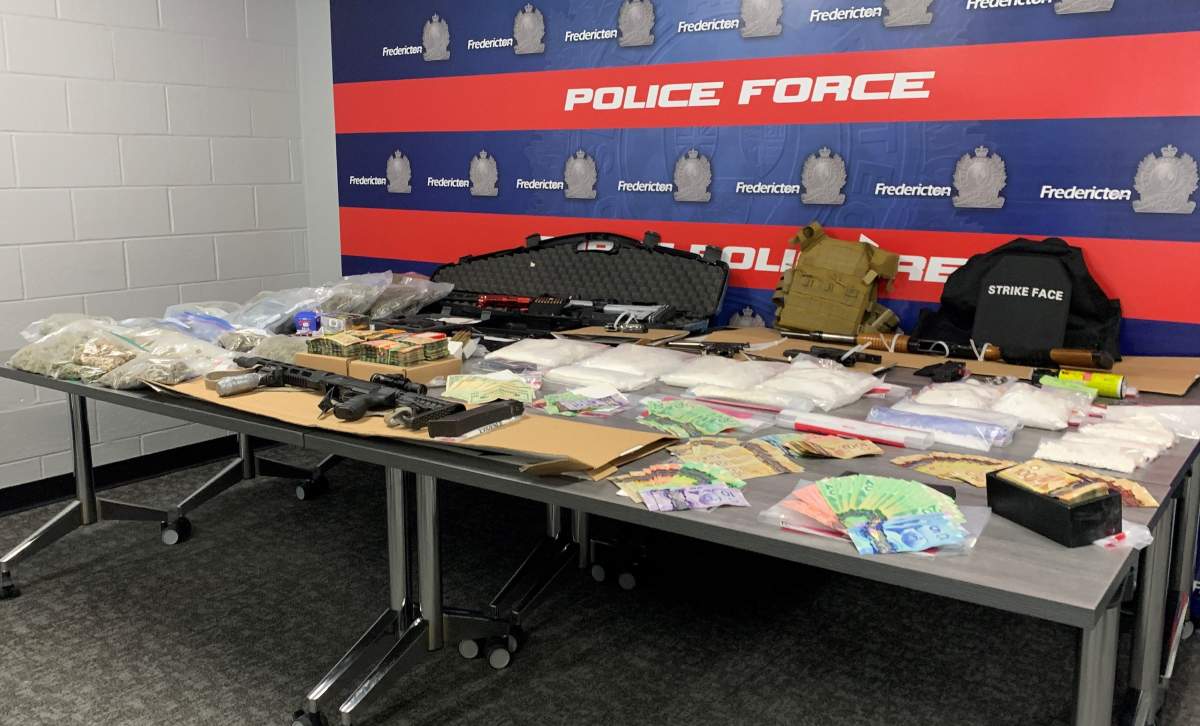 Seized items include crystal meth, cocaine, cash and various firearms, according to Fredericton police.