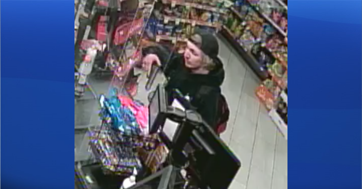 RCMP are looking for a man, seen here on CCTV, who's suspected of armed robbery at the Circle K in High River on April 28, 2022.