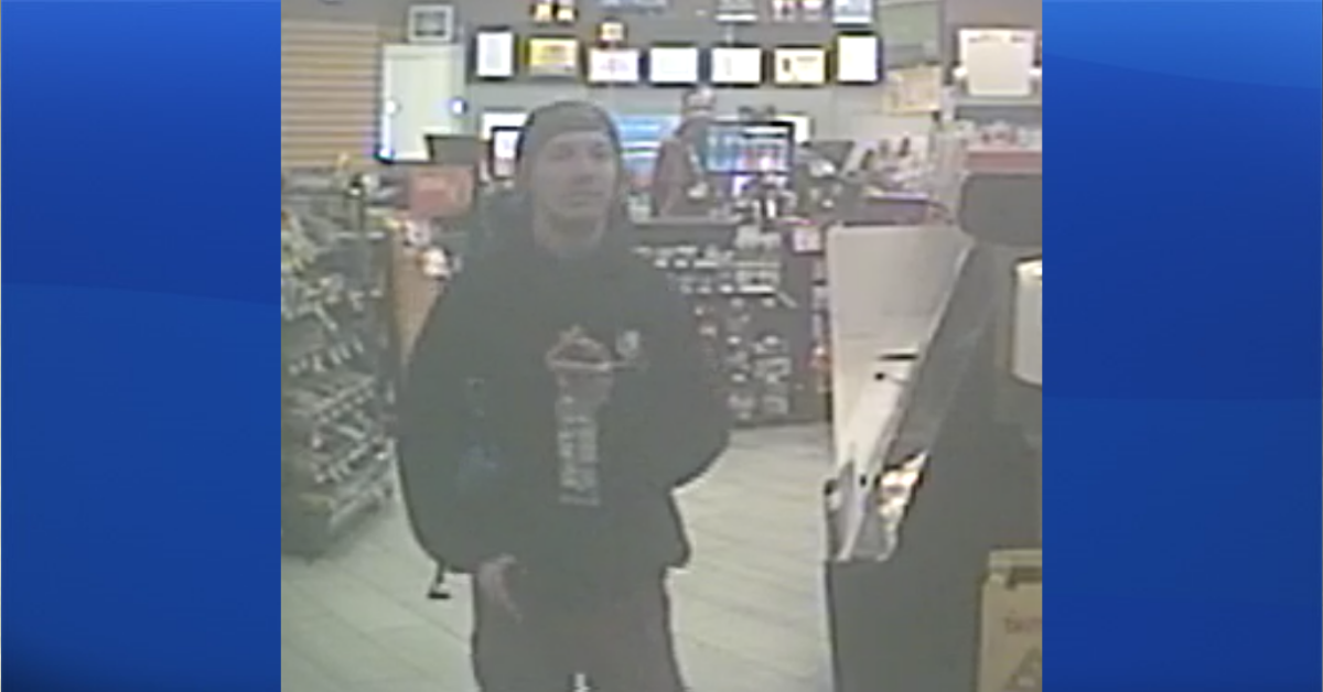RCMP are looking for a man, seen here on CCTV, who's suspected of armed robbery at the Circle K in High River on April 28, 2022.