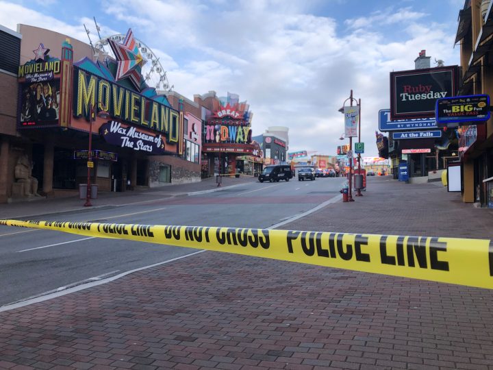 Police on scene following an April 8, 2022 fatal shooting on Clifton Hill in Niagara Falls.