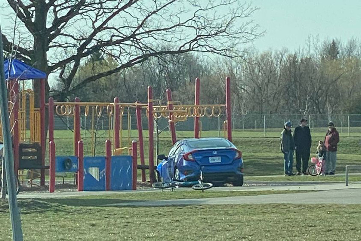 The car came to rest against a playground in Kitchener.