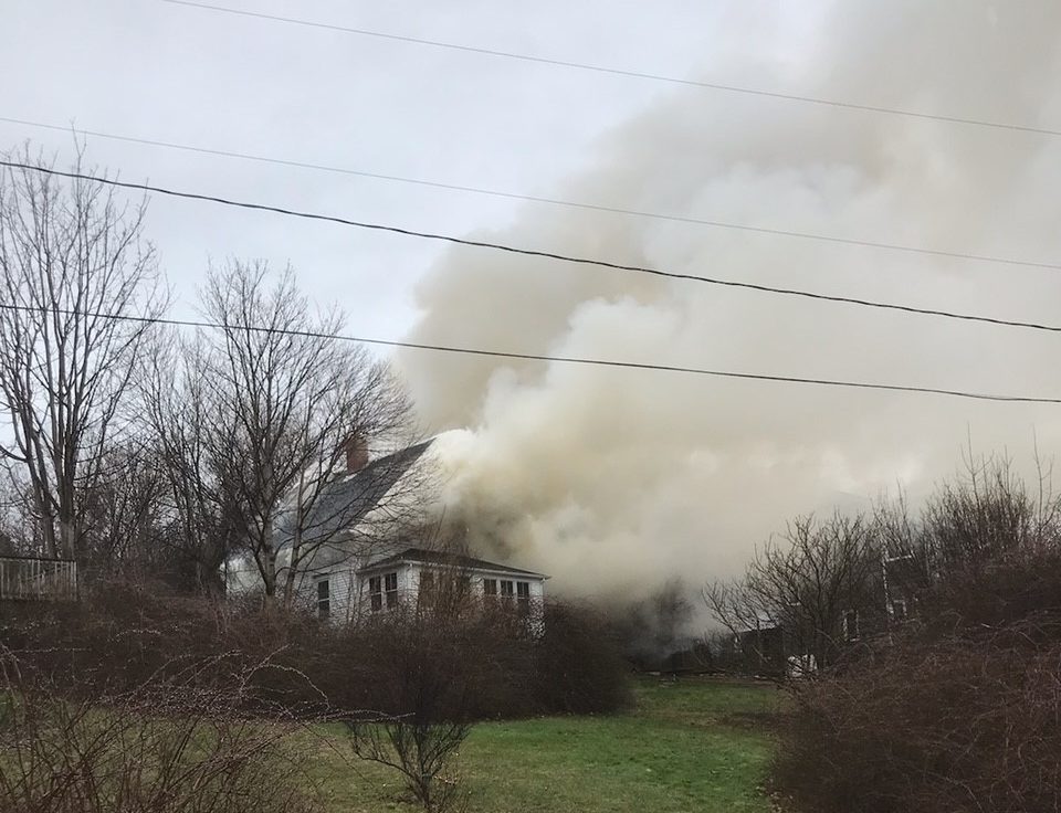 A home is seen engulfed in smoke in Smith's Cove, N.S.