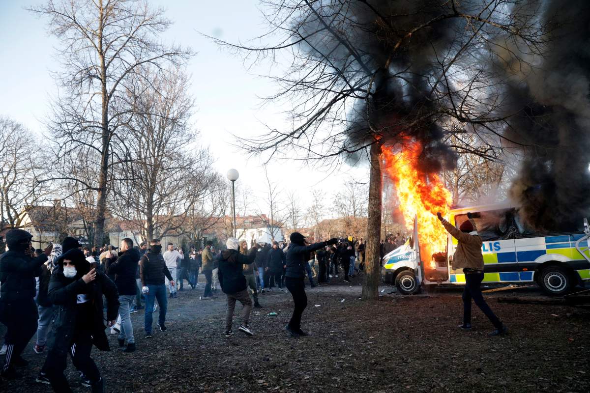 sweden riot police protest fire