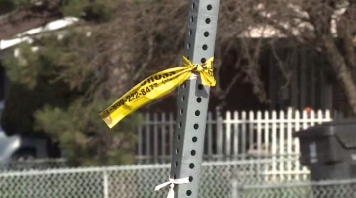 Officers put up police tape in Etobicoke on April 18, 2022.