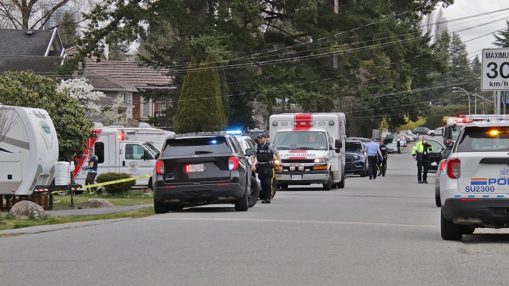 Police and paramedics respond to a shooting in Surrey's Whalley neighbourhood on Friday afternoon. 